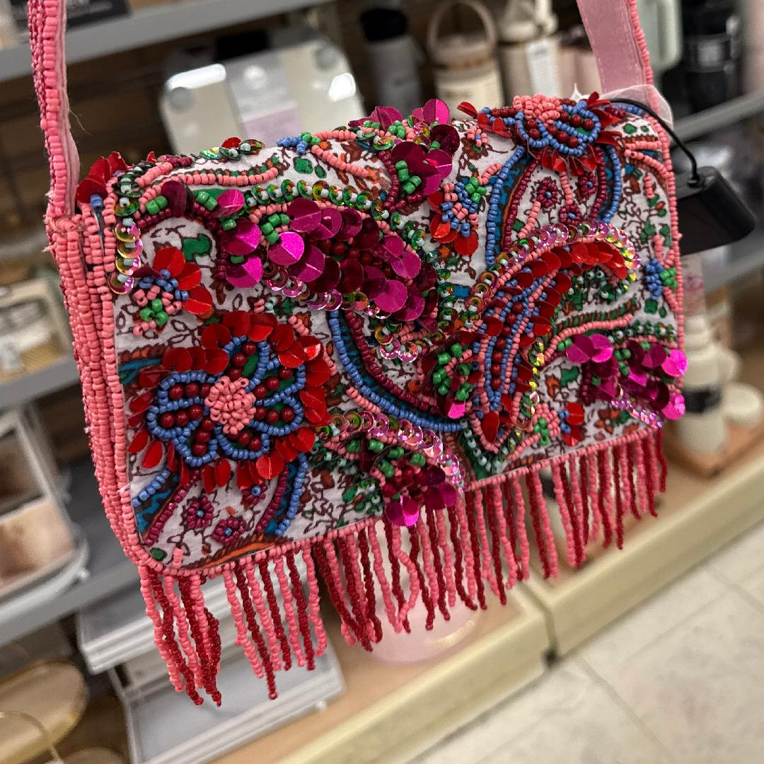 Colorful beaded handbag with pink strap and fringe
