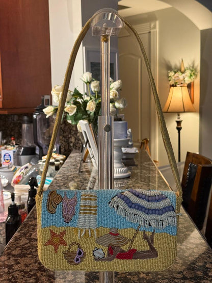 Decorative handbag with beach scene design on a kitchen counter