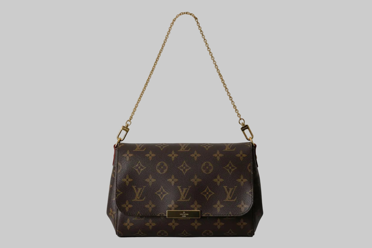 Designer handbag with monogram pattern on a white background