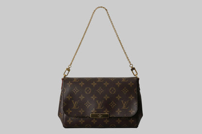Designer handbag with monogram pattern on a white background