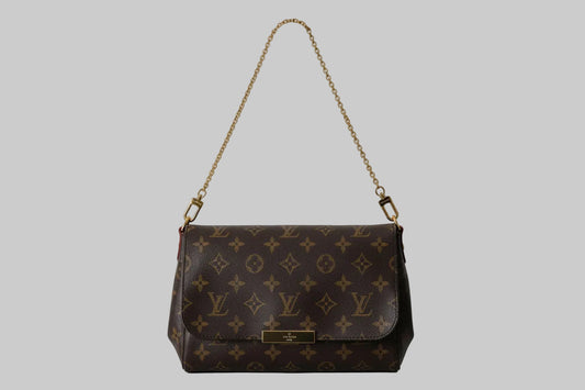 Designer handbag with monogram pattern on a white background