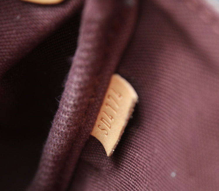 Close-up of a brown fabric with a visible brand label.