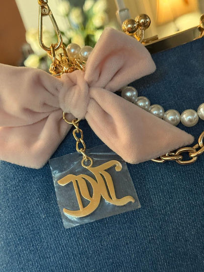 Trending Beaded Bags and Resort Collection - Juicy Couture Kisslock Denim Bag with Bow and Pearl Charm