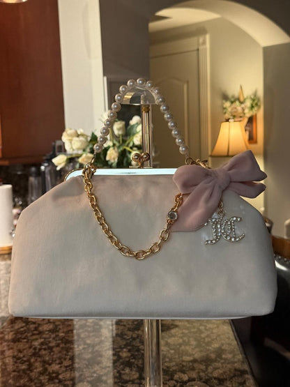 Trending Beaded Bags and Resort Collection - Juicy Couture Kiss Lock Blush Pink Velvet Cream Frame Bag