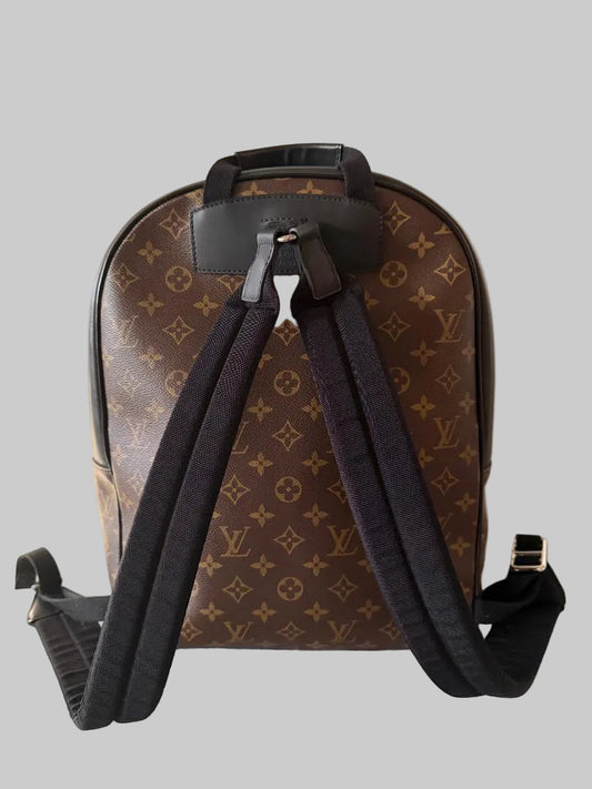 Brown monogram backpack with black straps on a light background