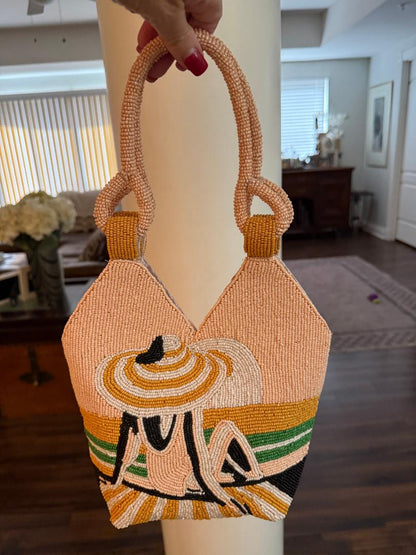 Trending Beaded Bags and Resort Collection - Peach Girl with Hat on Beach Top Handle