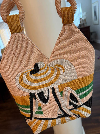 Trending Beaded Bags and Resort Collection - Peach Girl with Hat on Beach Top Handle