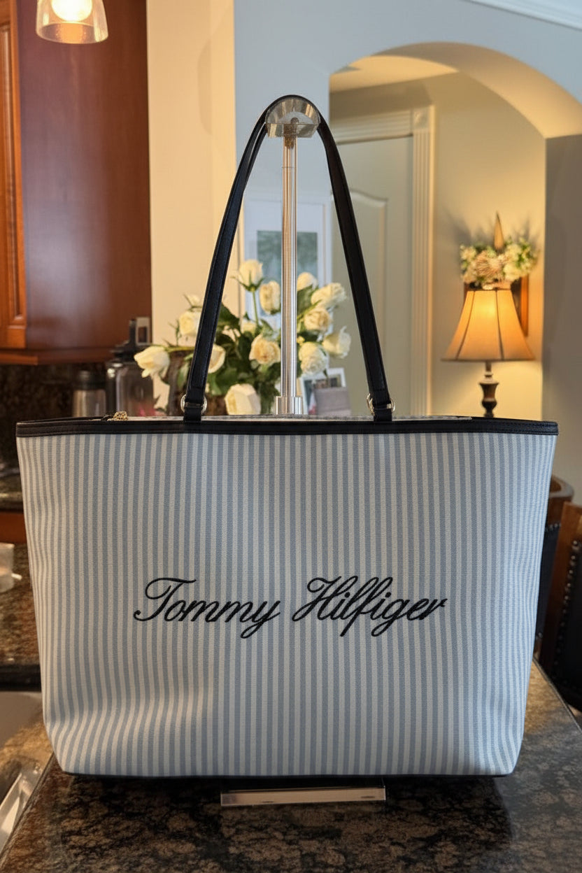 Striped tote bag with 'Tommy Hilfiger' logo in a room setting