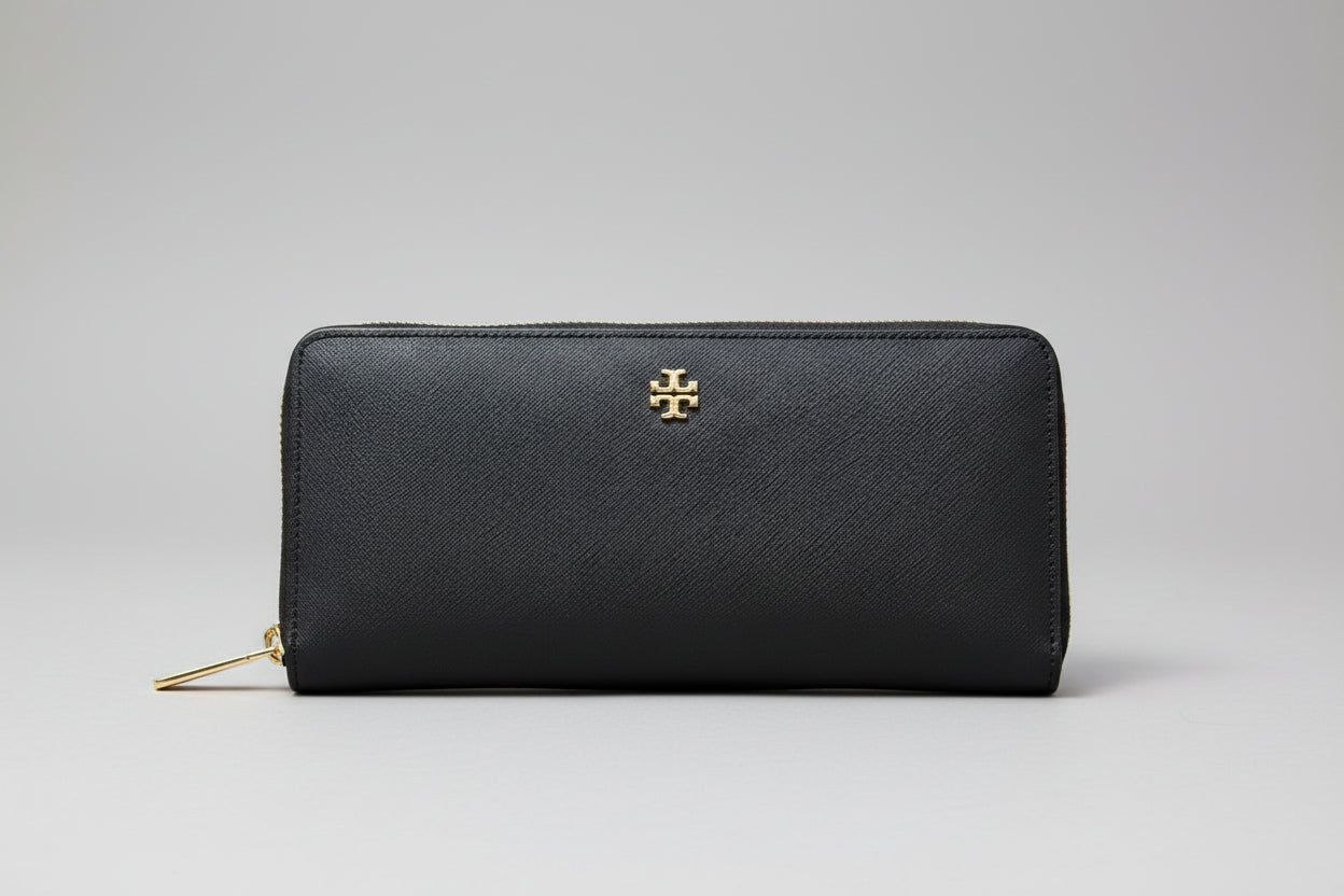 Tory Burch Black zip Around wallet with gold zipper and logo on a light gray background