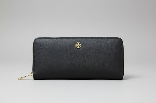 Tory Burch Black zip Around wallet with gold zipper and logo on a light gray background