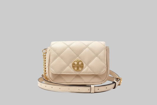 Tory Burch Cream/Beige quilted handbag with gold chain detail on a light gray background