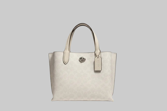 Coach White handbag with a visible brand tag with silver hardware and coach tag