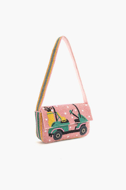 Pink beaded handbag with a decorative golf cart design on a white background